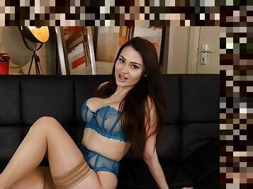 Jamie Knight in blue uw stockings strip on sofa