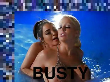 Busty lesbian pornstars with monster tits make out outdoors in the pool