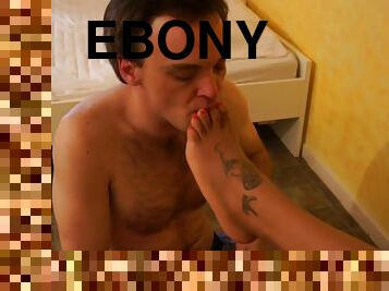 Horny guy enjoys licking and sucking ebony babe's feet