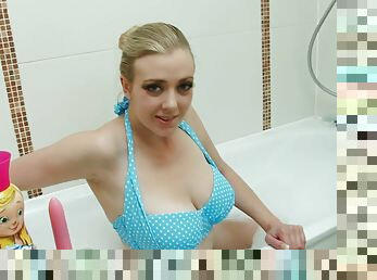 Blonde bikini beauty with large natural boobs taking shower