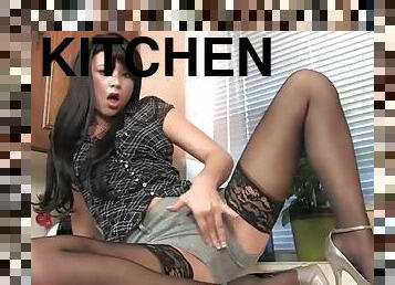 Foxy brunette Natalia spreads her legs to masturbate in the kitchen