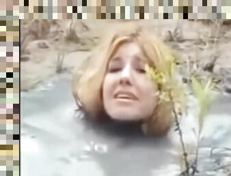 Crazy Bizarre Fetish Fully Clothed MILF In Big Puddle Of Liqued Dirt