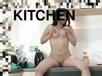 Home alone Tanya Cox drops her clothes and masturbates in the kitchen