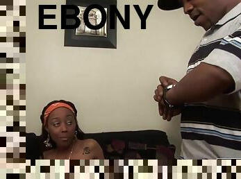 Ebony girl makes a long one-eyed snake disappear