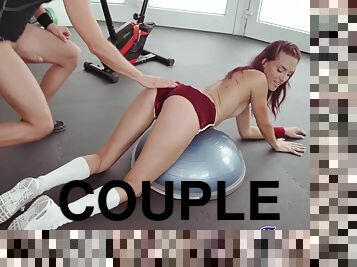 Redhead cutie drops her clothes to have sex in the home gym