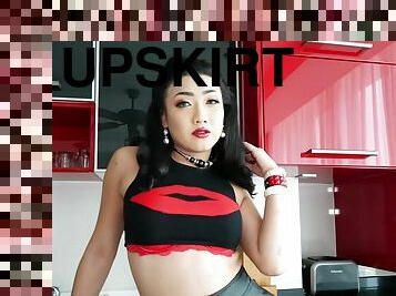 Very feminine Thai transsexual babe Paeng upskirts and flashes her sexy goods.