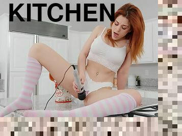 Hot ass redhead Molly Stewart plays with her vibrator in the kitchen