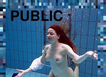 The redhead Marketa in a white dress in the pool