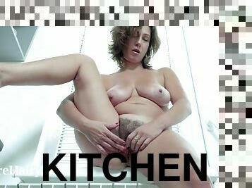 She masturbates in the kitchen