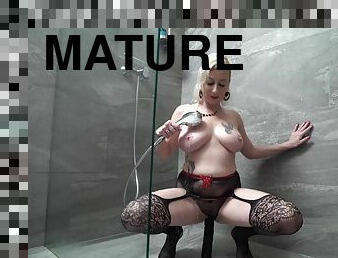 During the shower tattooed blonde masturbates in the bathroom