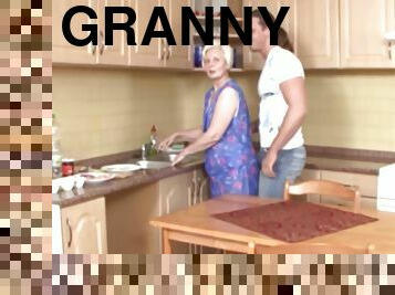 sexy granny Kaitlin spreads her legs for a friend's penis in the kitchen