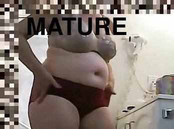 A meaty 52 years old female with big saggy tits and a round fat ass.