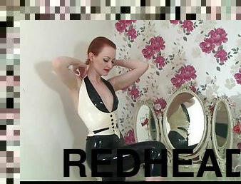 Redhead Anita de Bauch removes her latex outfit to show off her tits