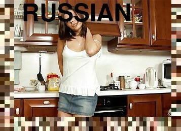 Russian babe Henessy deepthroats and rides cock in the kitchen