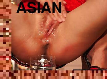 Asian barmaid plays with her shaved cunt with her vibrating cockring and squirts