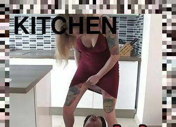 BDSM domina peeing on her sub face in the kitchen after trampling