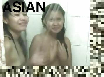 Two hot Asian babes enjoy a threesome after they shower together