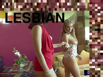 Elegant and beautiful lesbians kiss and pleasure each other in a modern mansion