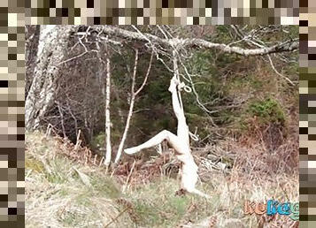 Naked self-bondage in the woods gone wrong.