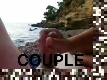 Couple relaxes and lucky guy gets good handjob