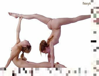 Naked ballerinas do their stretches together