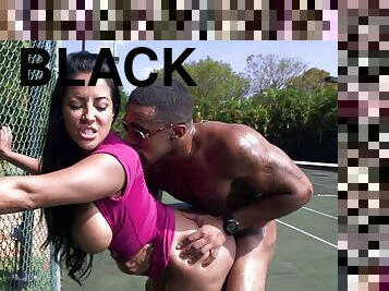 Bubble butt Kiara Mia enjoys riding a black dick on a tennis court