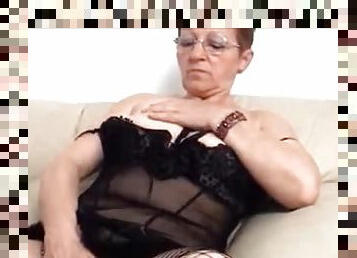 Lewd short-haired granny pleases herself with fingering