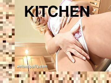 Yasmine enjoys drilling her pussy with a dildo in the kitchen