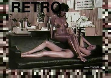 A retro video with two ebony lesbians licking pussies