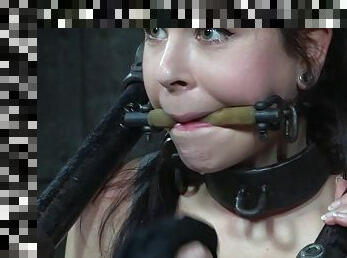 Foxy slut Amber gets restrained by a kinky dungeon machine