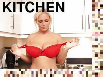 Horny blonde pours milk all over her bouncy tits in the kitchen