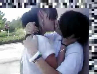 Two hot teens snogging