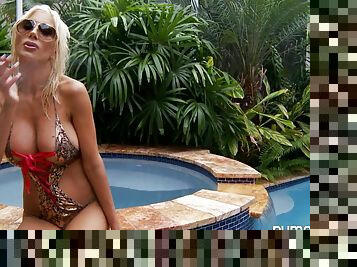 Solo blonde model Puma Swede fingering pussy in the pool outside