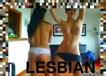 Three lesbians Tease Around Topless In A Bedroom