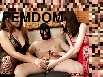 Two sexy women and a masked man plaing hardcore fetish games