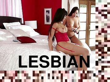Lesbians with a strapon and a dildo having orgasmic fun