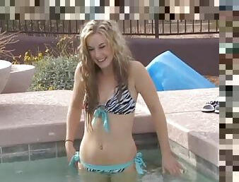 Flat chested teen blonde taking swim in the pool and teasing