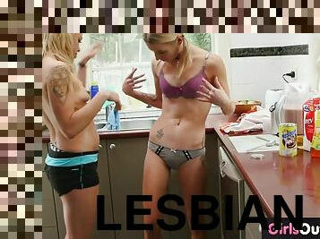 Slim blonde lesbian babes lick each other in the kitchen