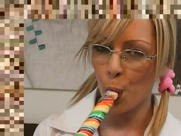 Engaging blonde Jessica plays with a lollipop and toy