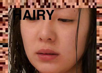 Minori Hatsune fingers her hairy Japanese pussy in the shower