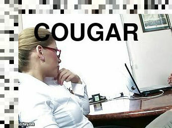 A horny cougar sucks her co-worker then fucks him on top of her desk