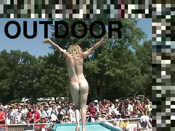 Palpitating cowgirls with long hair in high heels put up wild performance outdoors