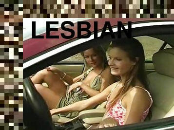 Vivacious lesbian couple enjoys pussy licking in the car