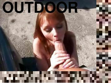 Cocksucking redhead Marie McCray outdoors