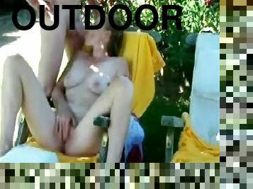 Masturbating on his girlfriend outdoors