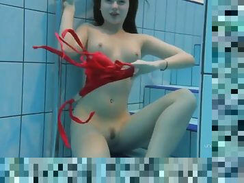 Beauty Katie in a red swimsuit with a thick pussy underwater