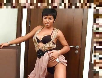Short haired ladyboy with big tits strips in black lingerie