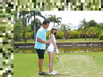 Golf tutor teaches amateur Shae Celestine how to handle a shaft