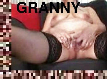 Granny takes time playing with her pussy