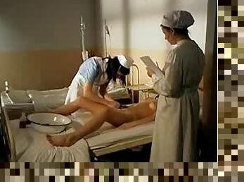 Nurses play while a man in a body cast watches